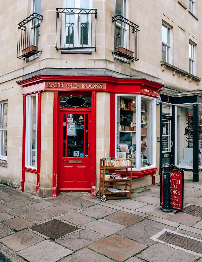 Cozy and grandiose bookstore with red facade and street display, one of the magical libraries and bookstores worldwide. Cozy and grandiose bookstore with red facade and street display, one of the magical libraries and bookstores worldwide.